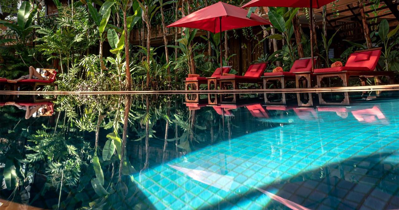 Angkor Village Hotel - Small Luxury Hotels Of The World Сием Реап Екстериор снимка The swimming pool at the resort